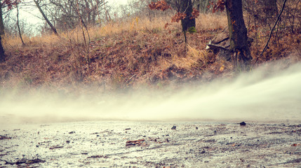Hose eliminating mud after flooding.