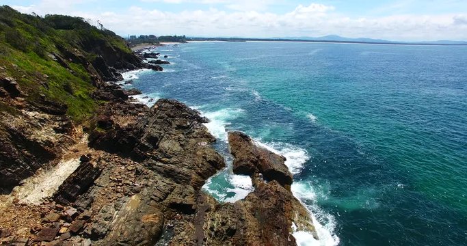 Australia aerial, waves on rocky coast