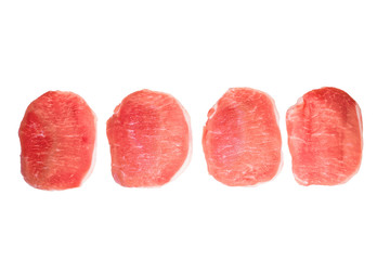 Four pieces of pork meat isolated on white background.