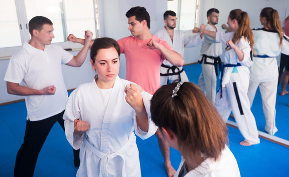 Adults training at karate class
