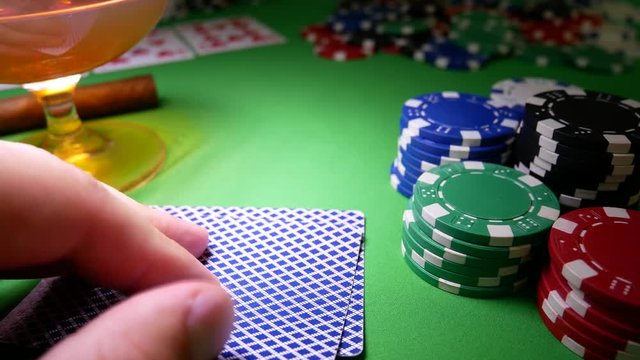 Gambling Poker Player Moves Chips on Table at Casino. Casino Chips. Winner In Poker. Poker Player Risk