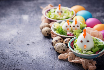 Salad with eggs in shape of chickens. Festive food.