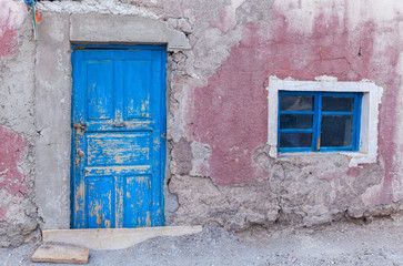 pink wall and blue old door