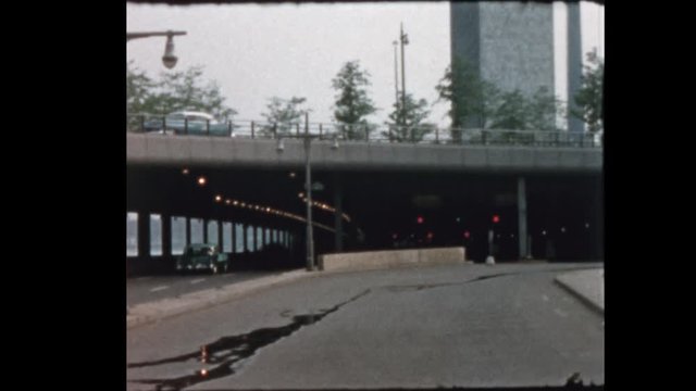 1956 Man watching cars on FDR Drive and United Nations New York City