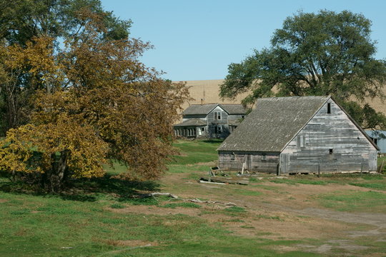 These large wooden barns, especially when filled with hay and provide protection to livestock