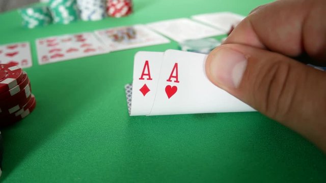 Gambling Poker Player with Double Diamonds Aces on Table at Casino. Casino Chips. Winner In Poker
