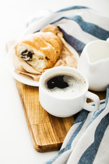 Morning coffee with croissant on the table