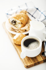 Morning coffee with croissant on the table