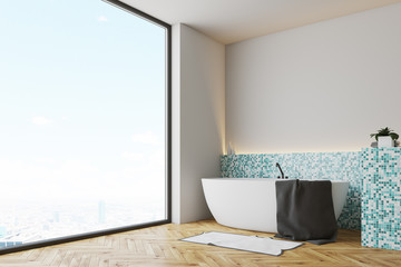 Green tile bathroom corner, white tub
