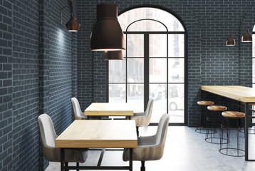 Black brick cafe, wooden tables side