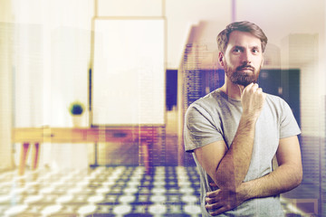 Man in blurred living room with chest of drawers