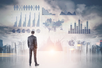 Businessman looking at infographics