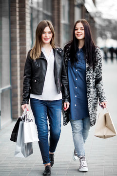 Friends are happy shopping, walking near shopping centers