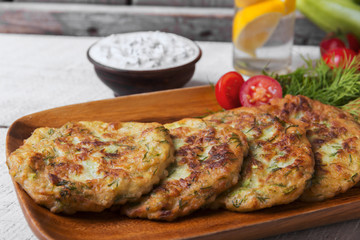 pancakes zucchini fritters vegetarian dish yogurt sauce