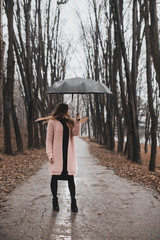 Beautiful girl with black umbrella