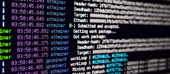 Macro snapshot of the program interface for crypto currency mining on the monitor of an office computer. The concept of mining bitcoins. The flow of information strings and data