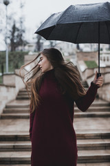 Beautiful girl with black umbrella