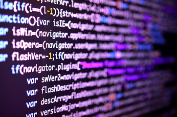 Macro shot of the command line on the monitor of the office computer. The concept of the programmer's work. Information line flow