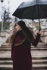 Beautiful girl with black umbrella