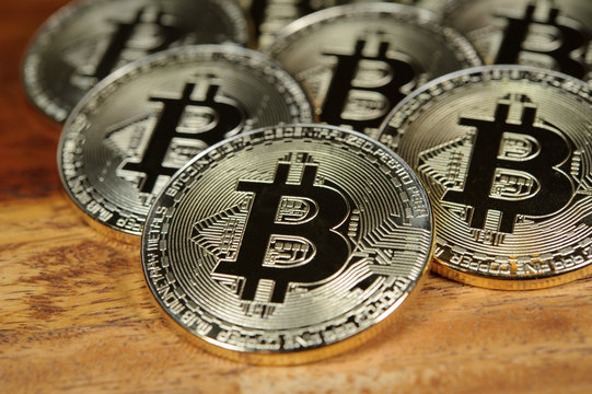 Bitcoins on wooden desk