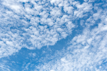 Fototapeta na wymiar Altocumulus cloudscape on blue blue sky, Beautiful Cirrocumulus or Altocumulus on the middle altitude layer