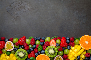 Various fresh fruits: strawberry, raspberry, blueberry, tangerin