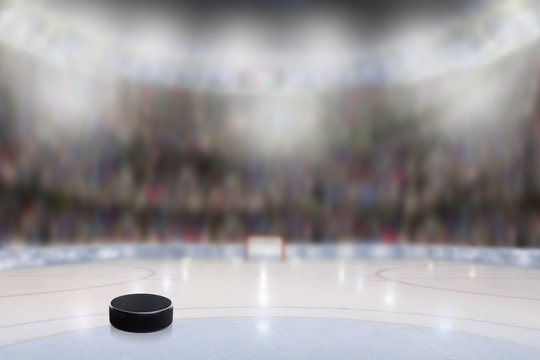 Ice Hockey Puck in Rink Arena With Copy Space