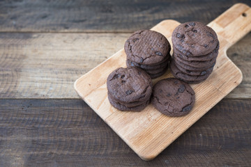 cookies on a wooden table.cookies stacked on a wooden board