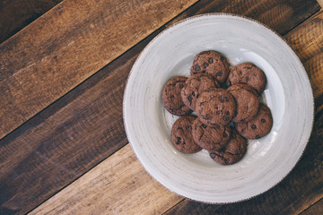 cookies in a plate on a wooden table