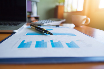Pen,keyboard,calculator,report graph chart on office table,for Business.