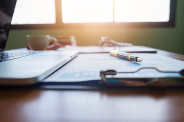 Pen,keyboard,calculator,report graph chart on office table,for Business.