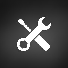 White settings tools icon on black background with shadow