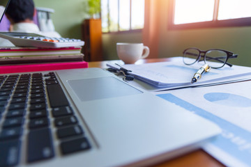 Pen,keyboard,calculator,report graph chart on office table,for Business.