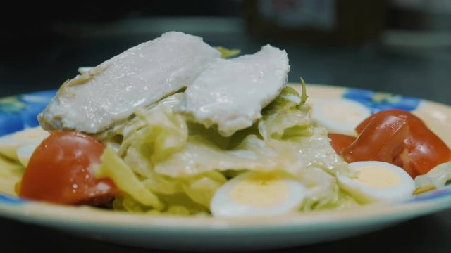 prepares Caesar salad