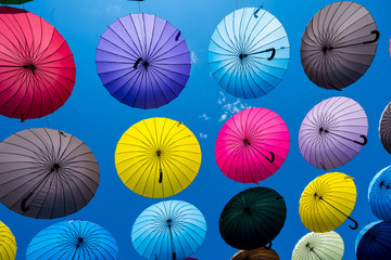 Fototapeta na wymiar Many colorful umbrellas. umbrella street decoration
