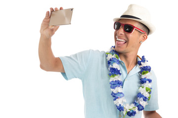 Happy man does selfie. Friendly and fun Latin American. White background..