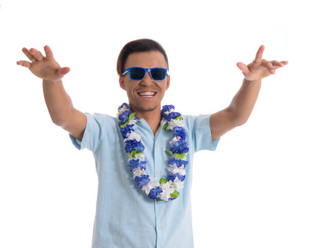 Young black man wears sunglasses and flower necklace..