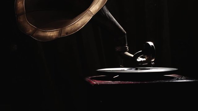 Old gramophone playing disc closeup.
