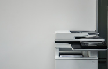 multifunction printer in office for printing, scanning, copying and sending fax