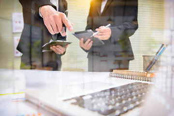 Business team meeting. Photo professional investor working new start up project. Finance task.Digital tablet docking keyboard laptop computer smart phone using