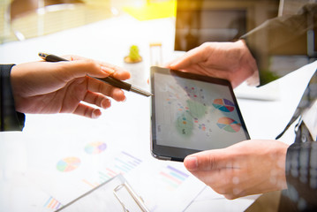 Business team meeting. Photo professional investor working new start up project. Finance task.Digital tablet docking keyboard laptop computer smart phone using