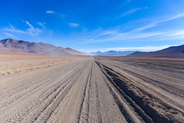 Fototapeta na wymiar The Car Trails in the Middle of the Desert, Bolivia, South America