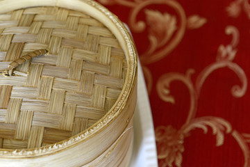 Dim Sum, Dumplings and Chinese buns on plate in bamboo basket