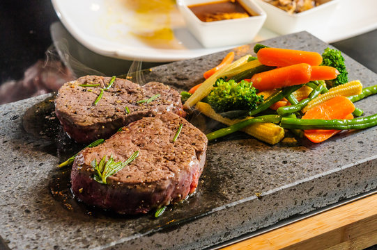 Steak cooked on lava-stone.