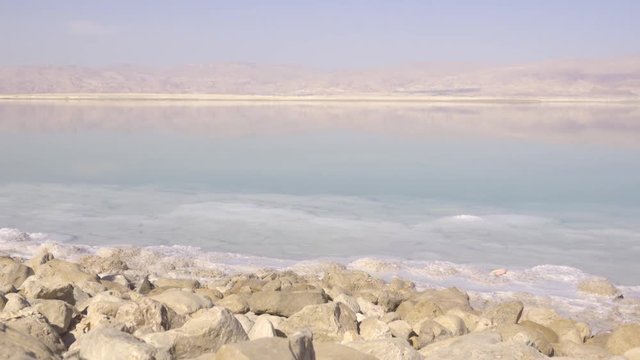 Tourist taking pictures of Dead Sea