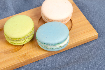 Colorful Yummy Macarons in Wooden Plate