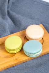 Colorful Yummy Macarons in Wooden Plate