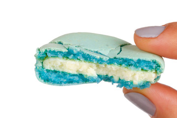 Hand Holding Bitten Macaron