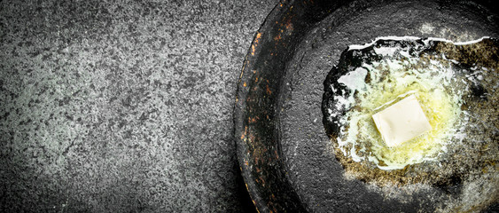 Butter in an old pan.