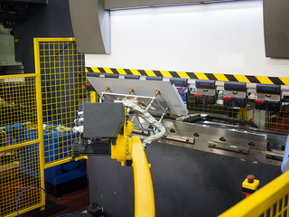 operator bending metal sheet by sheet bending machine